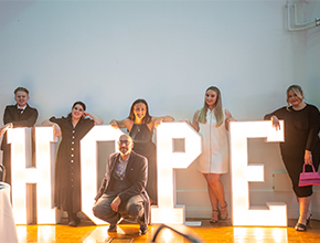 hope star awards organisers standing in front of the word 'Hope'